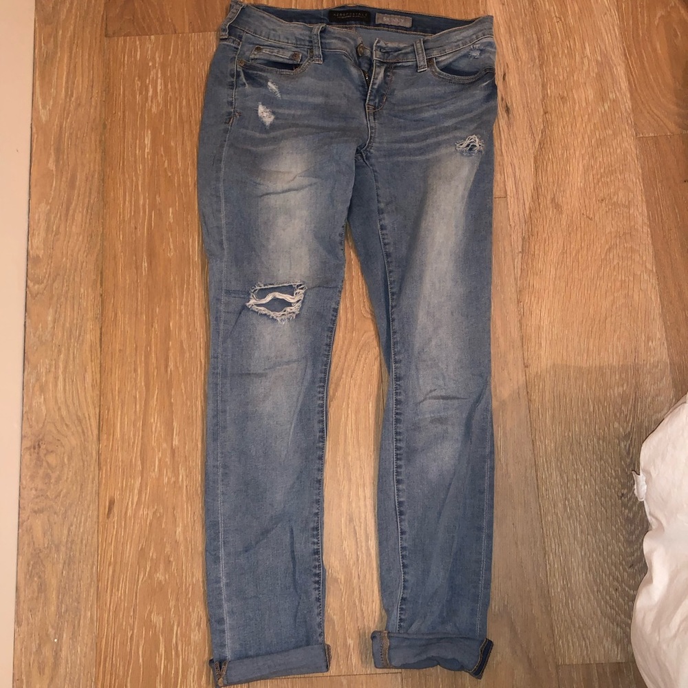 Colored jeans with small rips